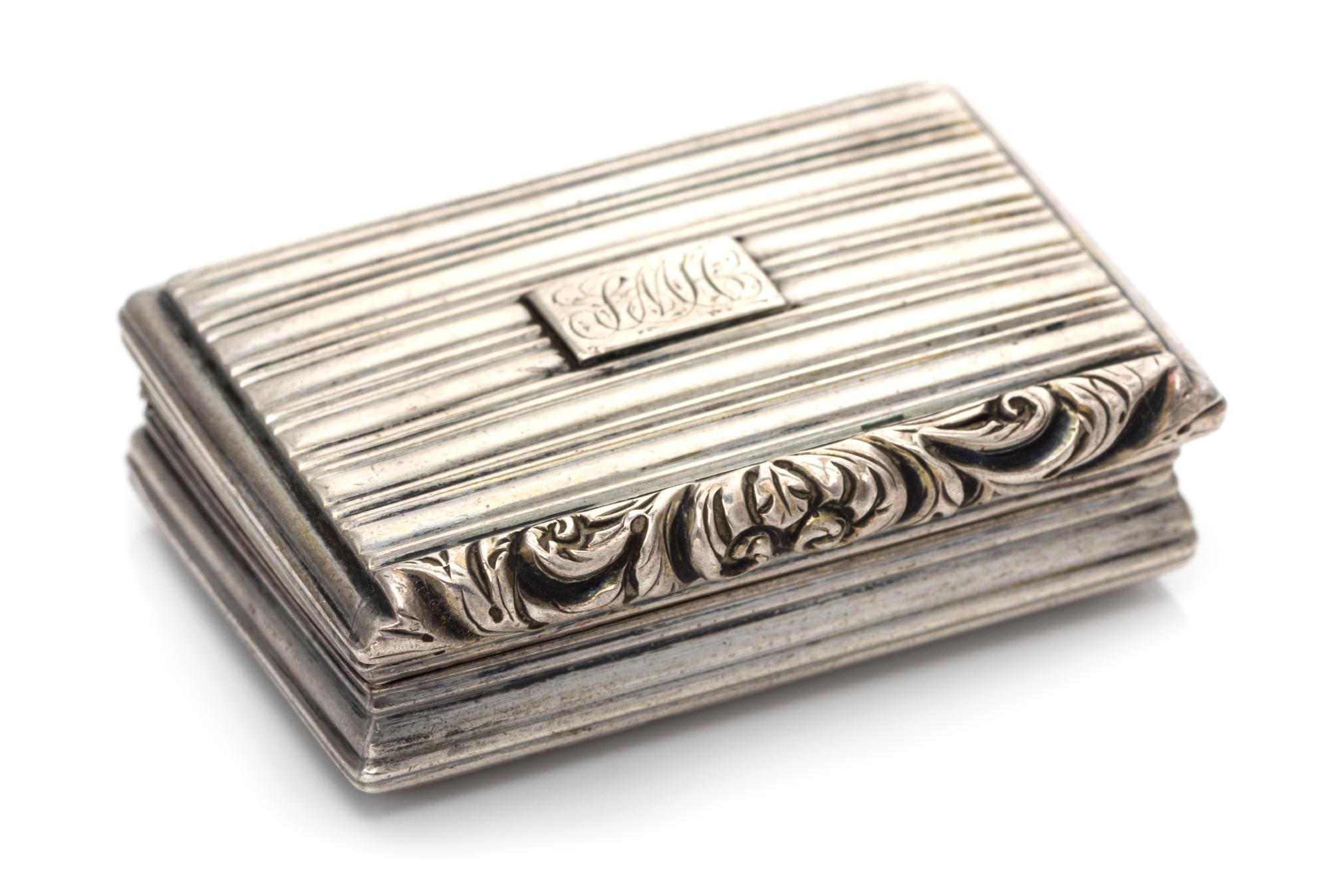 A George IV Silver Vinaigrette, Nathaniel Mills, Birmingham, 1830, having a ribbed case, the lid centered by a monogrammed cartouche, t