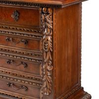 A Spanish Baroque Style Walnut Chest of Drawers