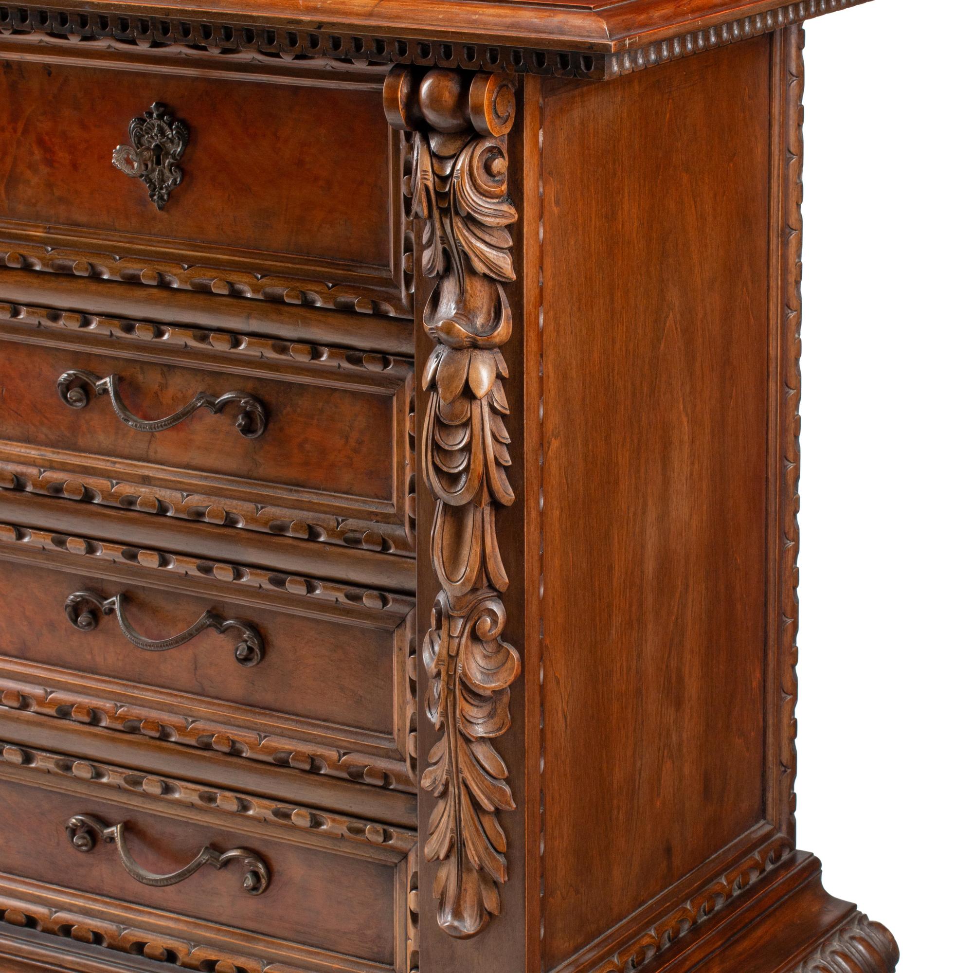 A Spanish Baroque Style Walnut Chest of Drawers