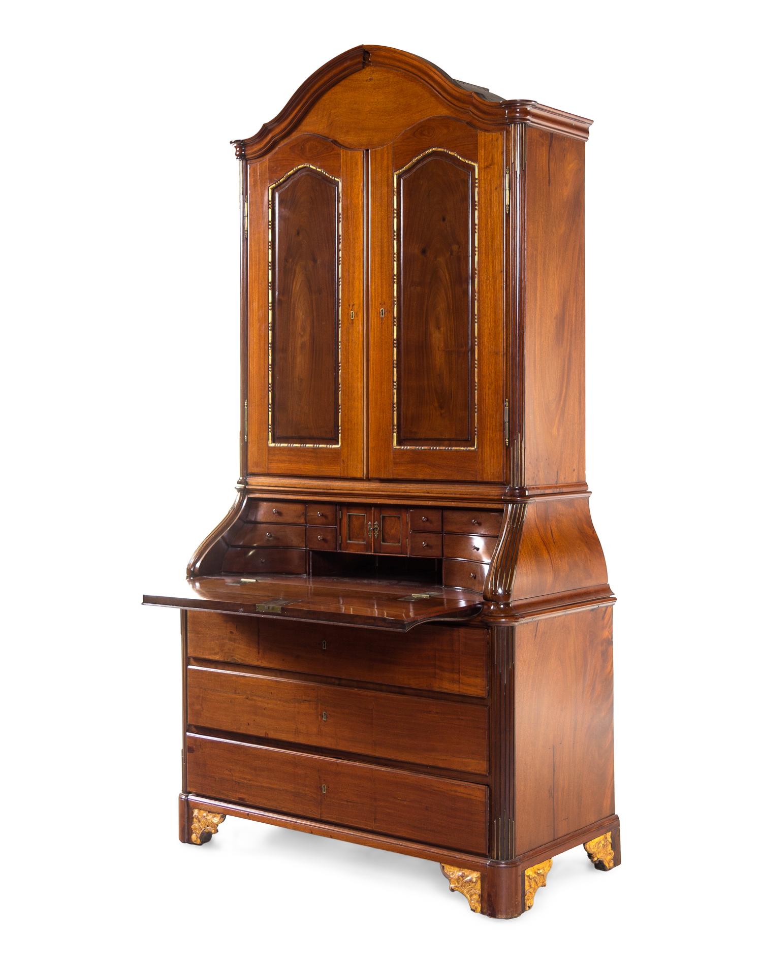 A Baltic Neoclassical Parcel Gilt Walnut Secretary