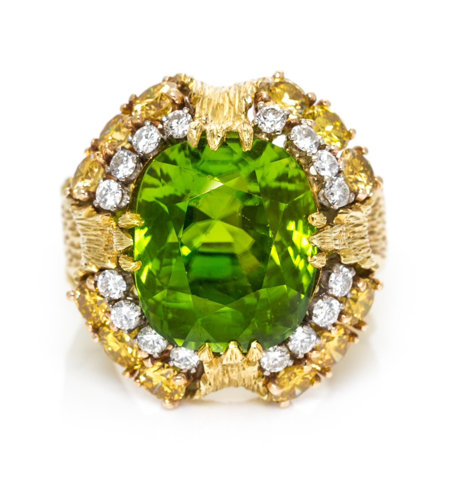 An 18 Karat Yellow Gold, Cushion Cut Peridot, Yellow and White Diamond Ring, 17.40 dwts.