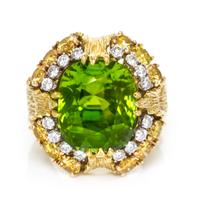 An 18 Karat Yellow Gold, Cushion Cut Peridot, Yellow and White Diamond Ring, 17.40 dwts.