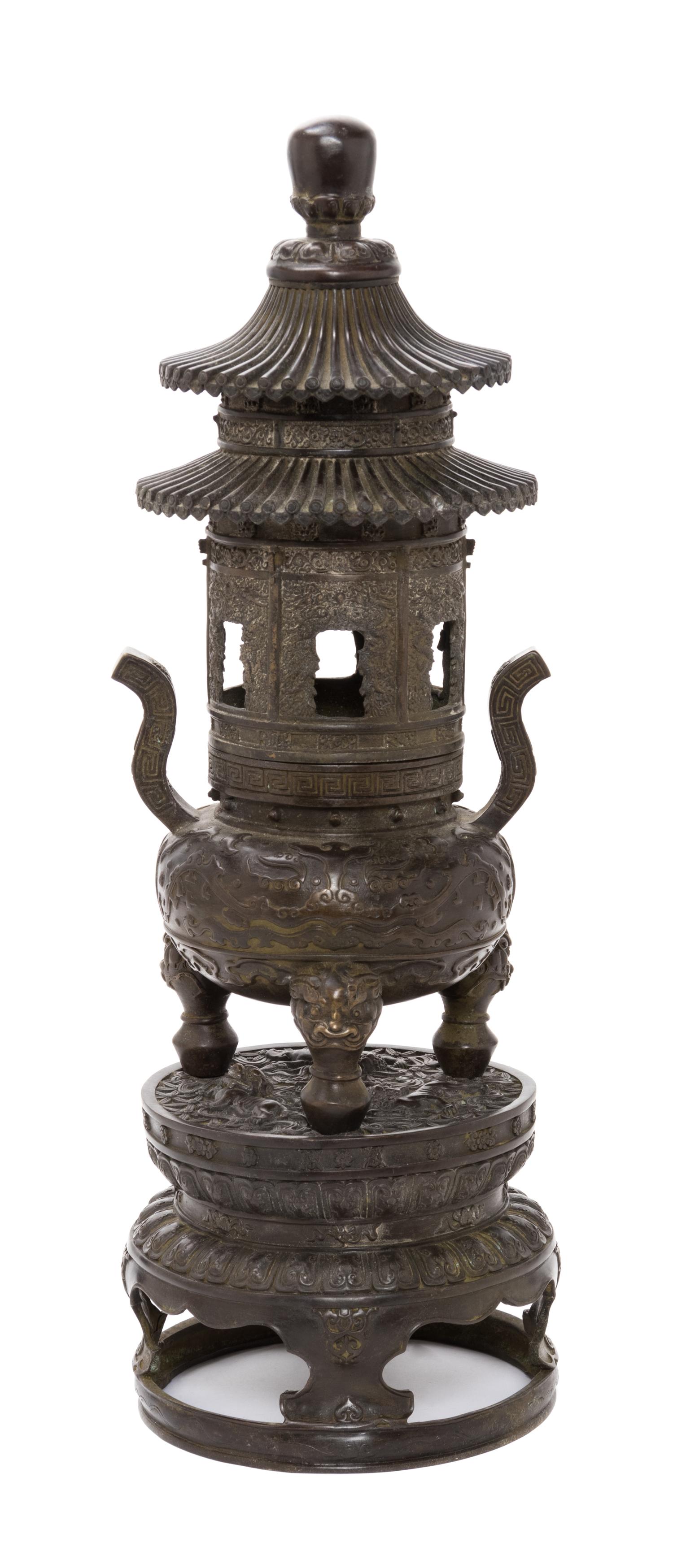 A Chinese Bronze 'Pagoda' Covered Incense Burner Height 19 inches. — 20TH CENTURY