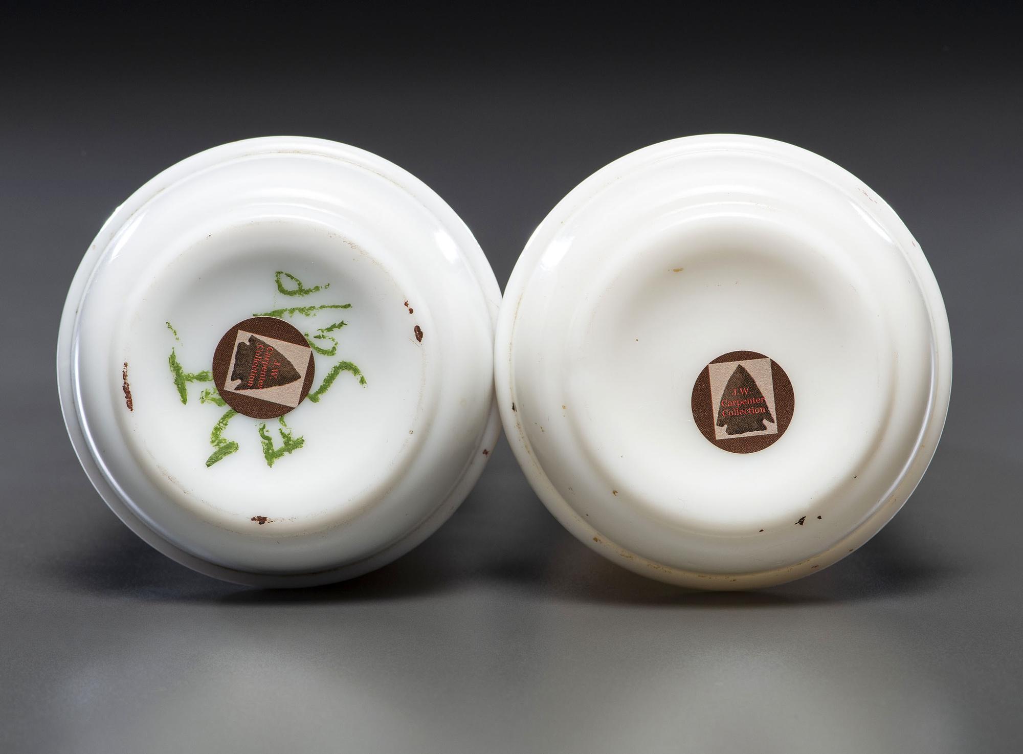 A Pair of Hand Painted Personalized Milk Glass Barber's Bottles