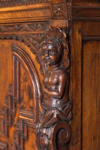 An Italian Renaissance Revival Carved Oak Cabinet