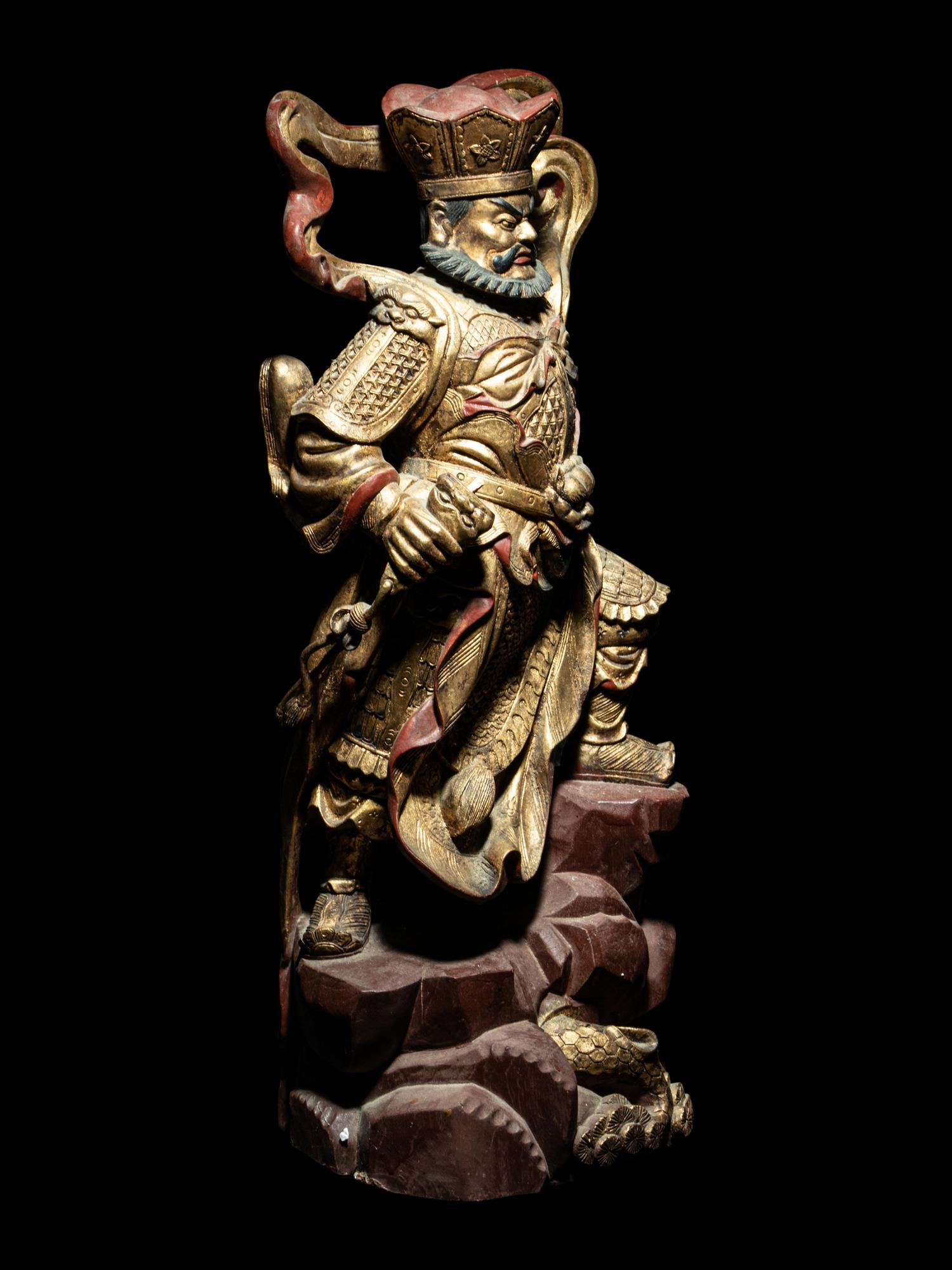 A Set of Four Gilt and Red Lacquered Wood Figures of Guardians