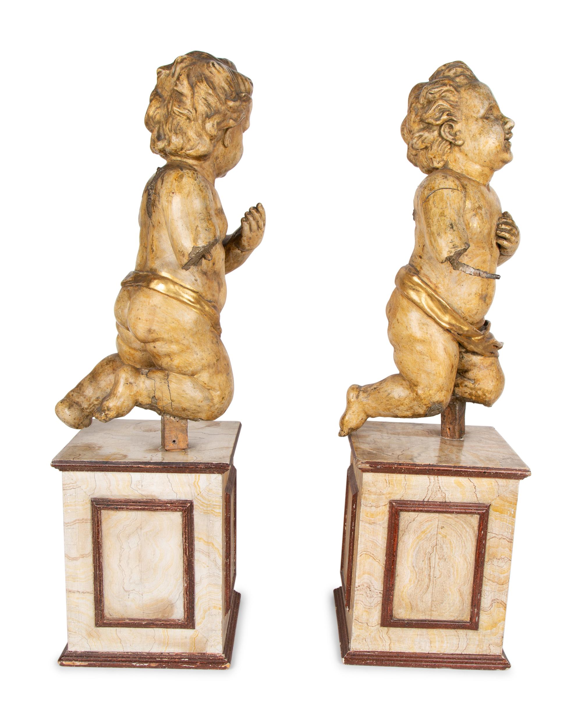 A Pair of Italian Carved and Parcel Gilt Cherubs — 19TH CENTURY