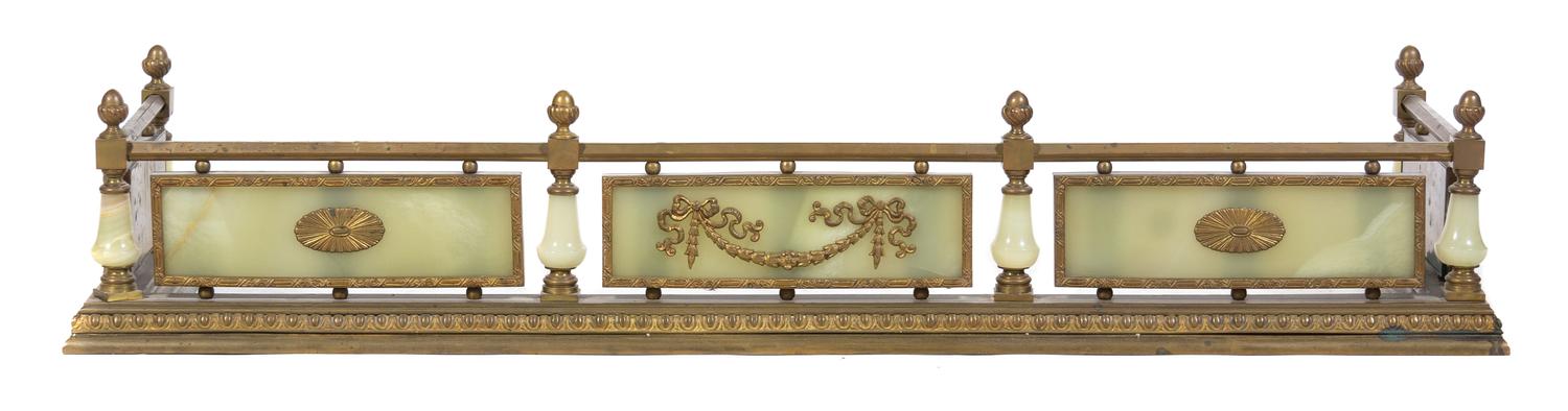 A Neoclassical Brass and Onyx Fire Fender Width 46 1/2 inches.