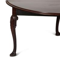 An Irish George II Style Carved Mahogany Drop Leaf Dining Table