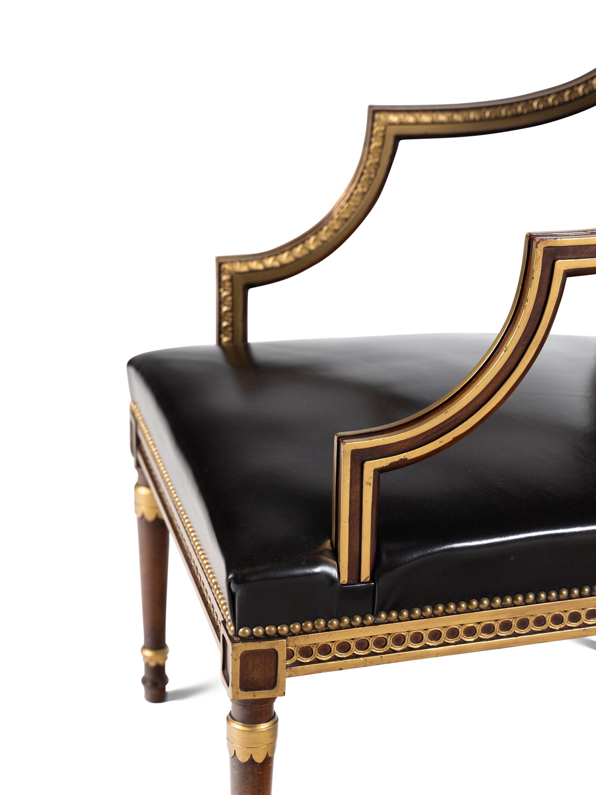 A Pair of Neoclassical Style Parcel Gilt Mahogany Armchairs