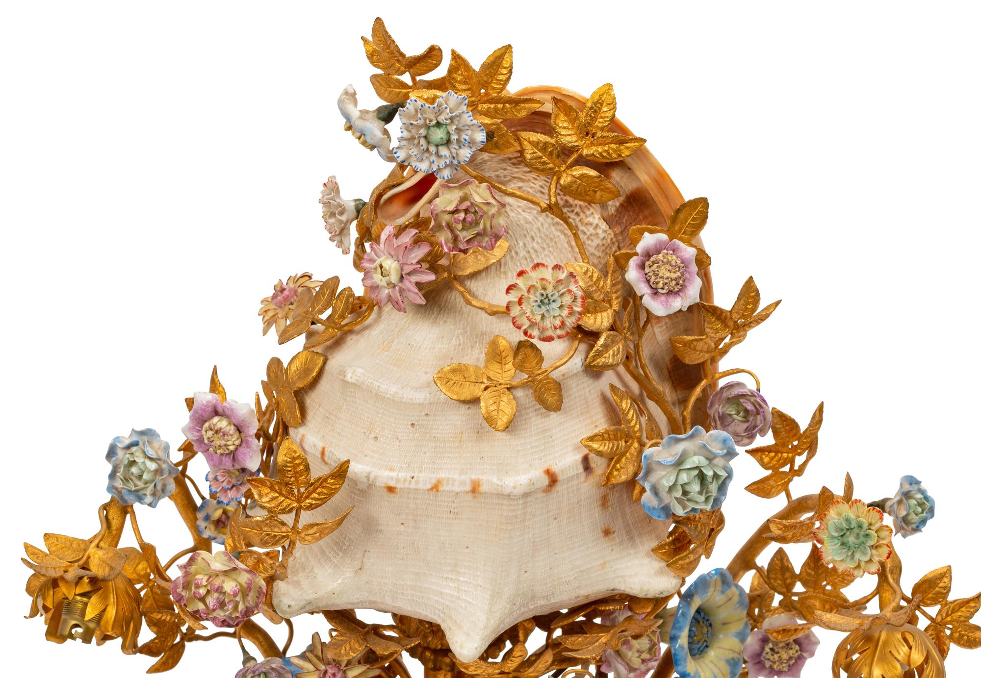A Louis XV Style Gilt Bronze, Porcelain and Seashell Mounted Sea Motif Lamp