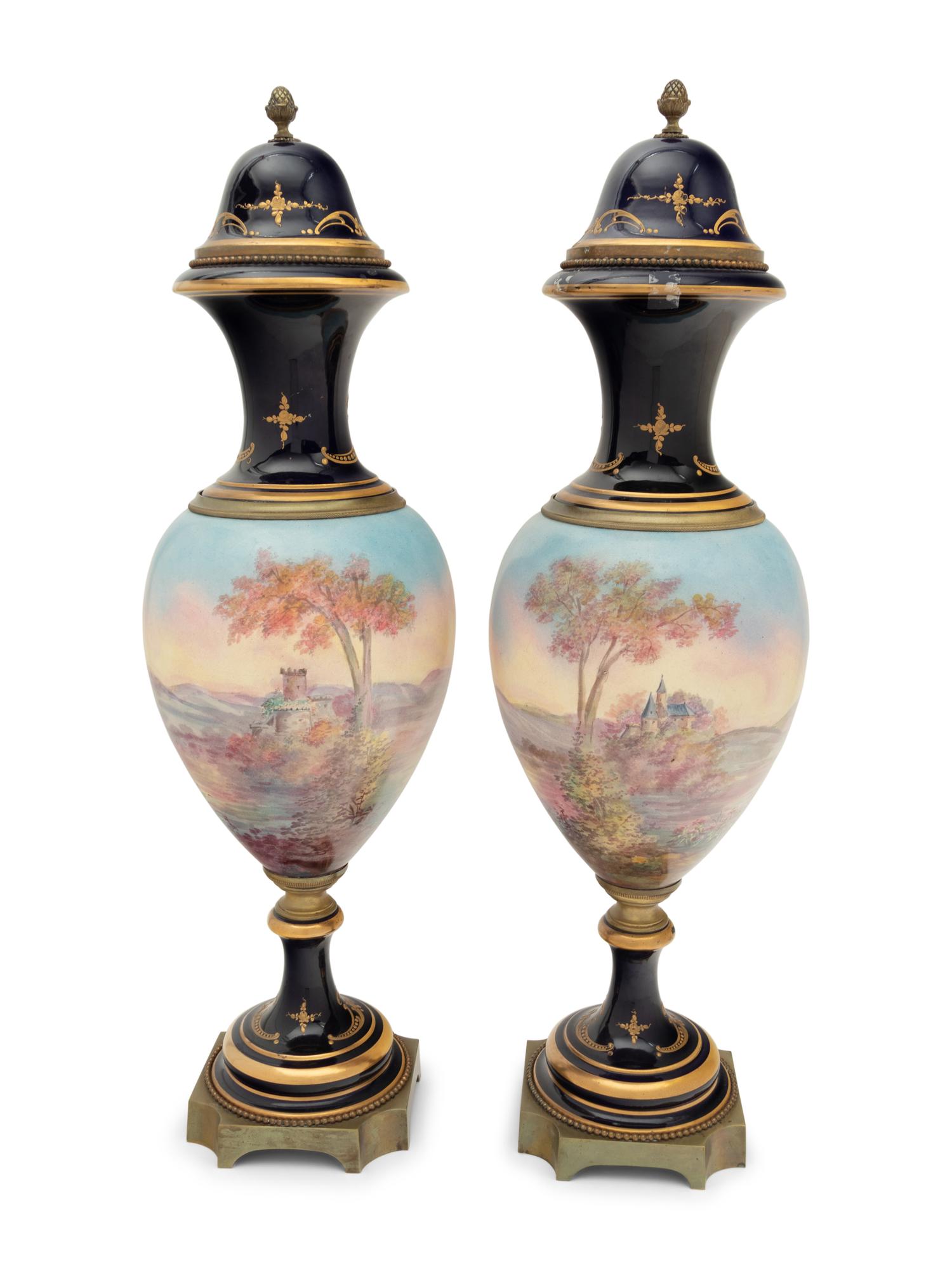 A Pair of Sèvres Style Gilt Bronze Mounted Porcelain Urns