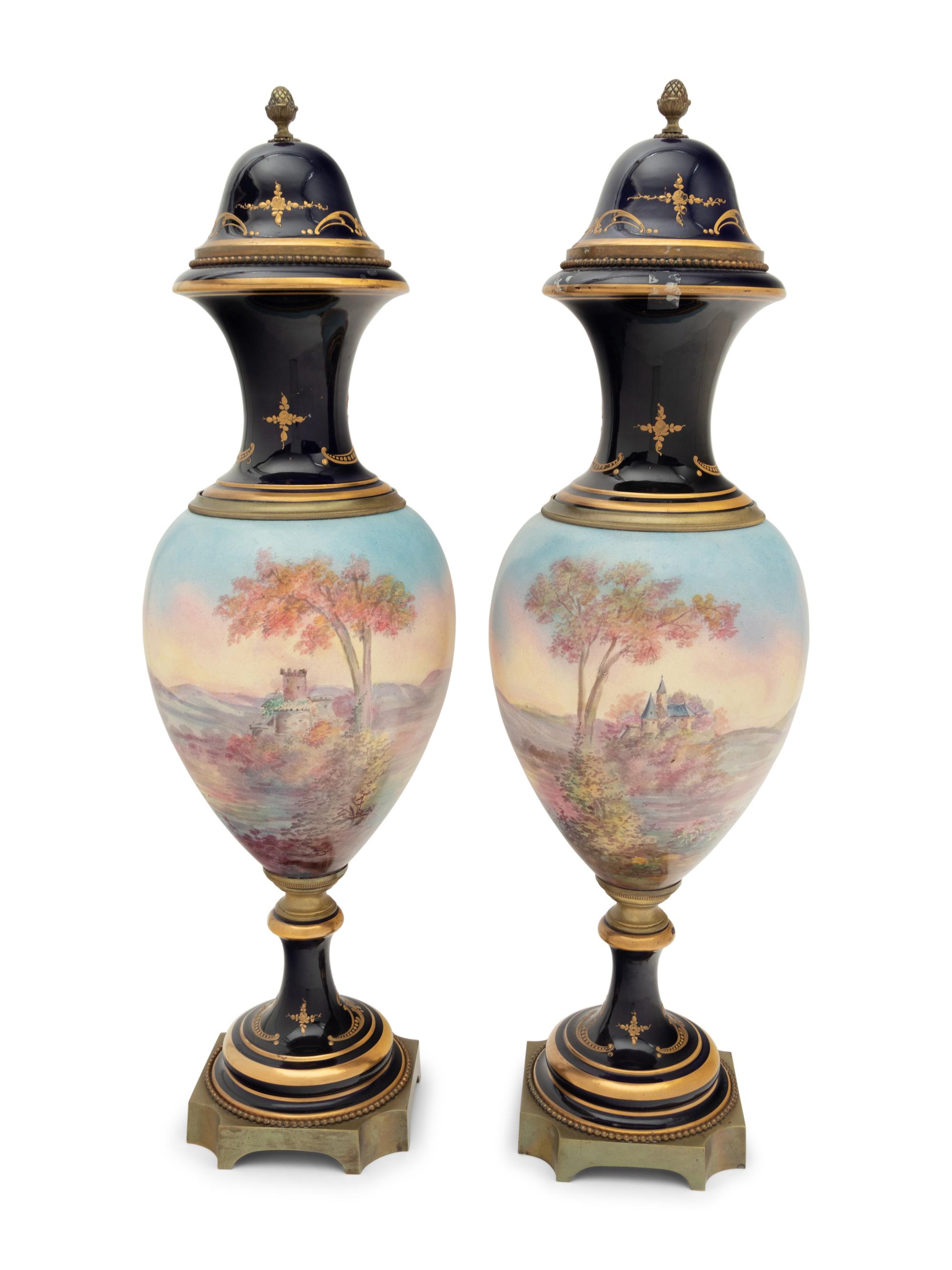 A Pair of Sèvres Style Gilt Bronze Mounted Porcelain Urns