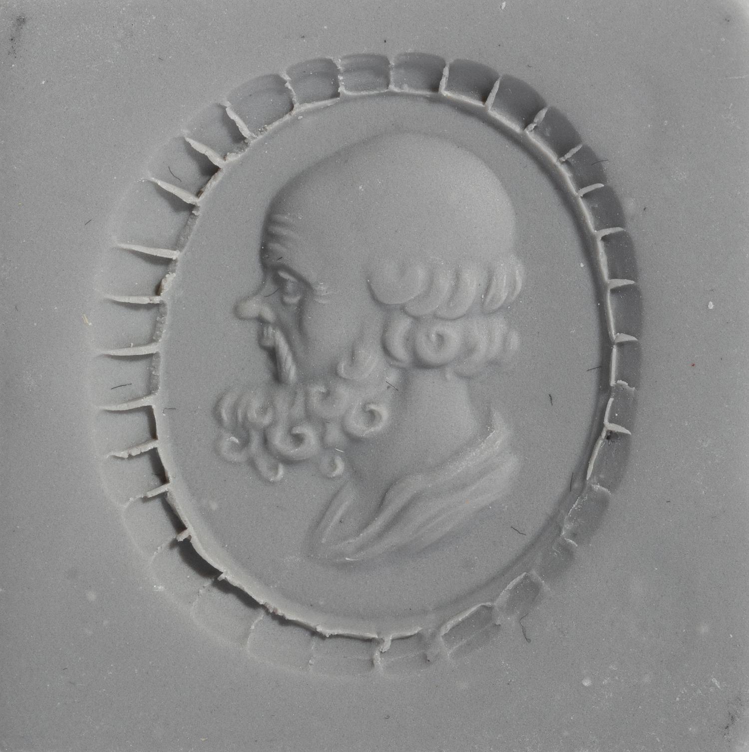 A Neoclassical Gold and Carnelian Finger Ring with a Portrait Head of Socrates