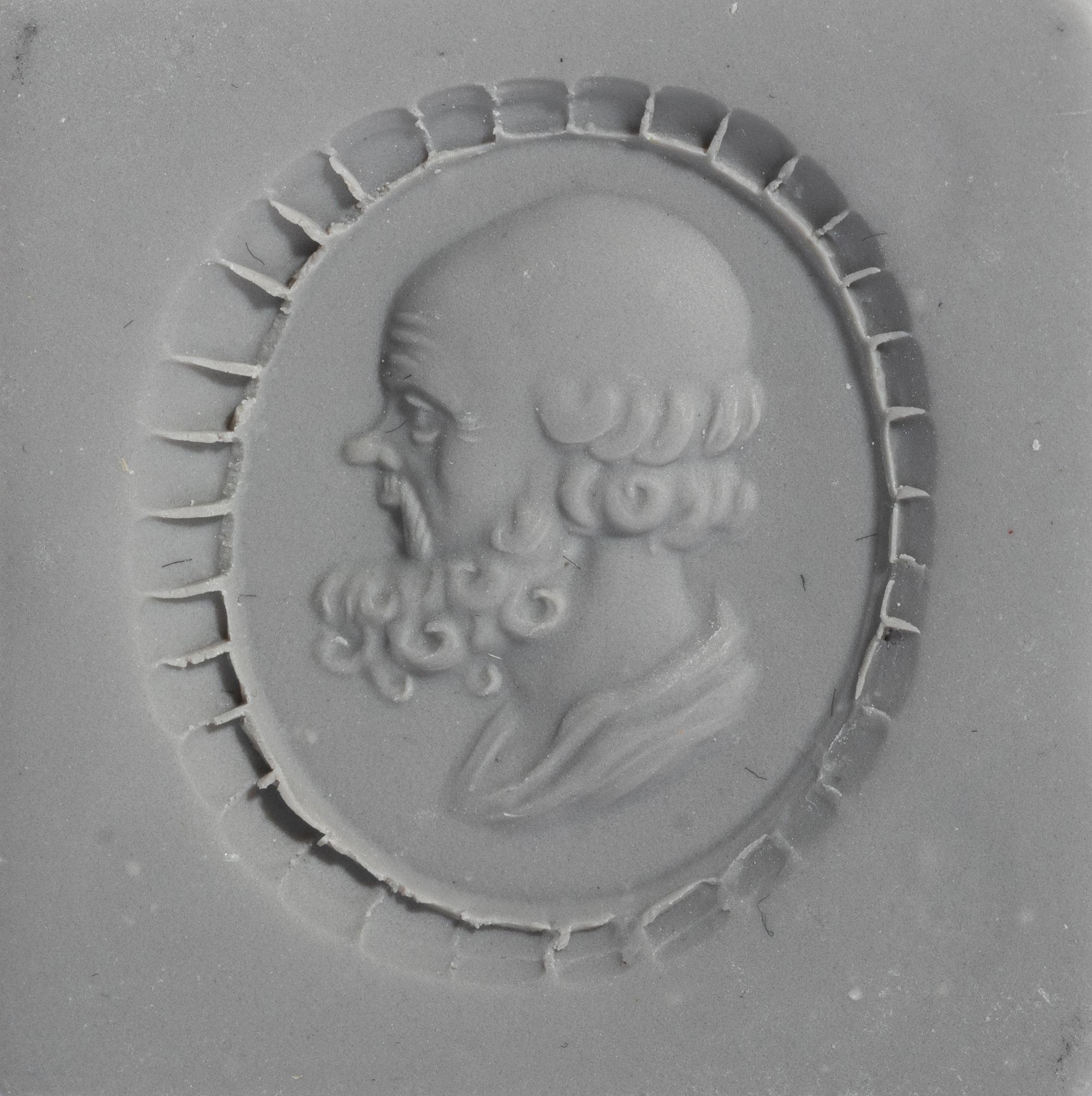 A Neoclassical Gold and Carnelian Finger Ring with a Portrait Head of Socrates