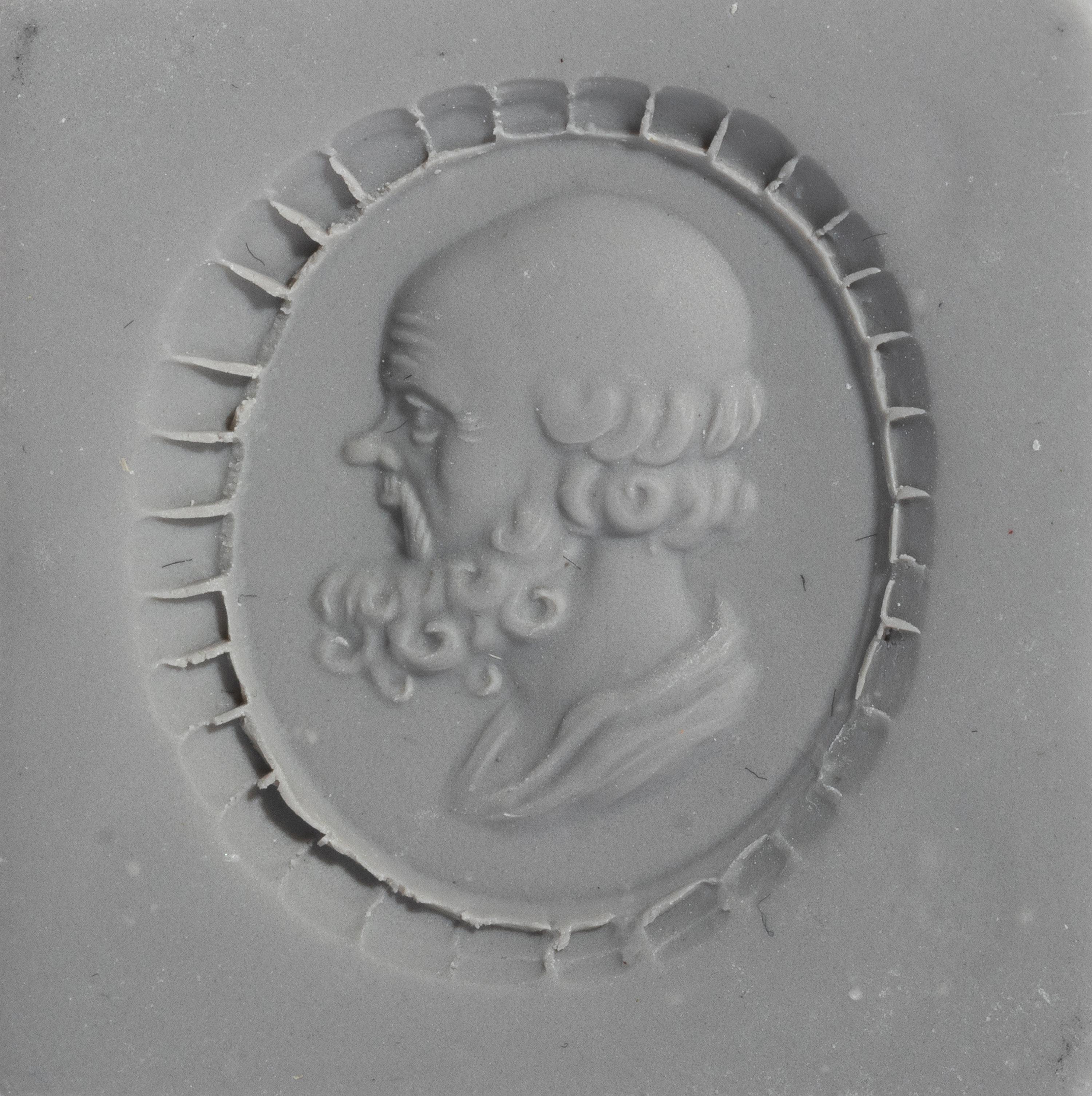 A Neoclassical Gold and Carnelian Finger Ring with a Portrait Head of Socrates