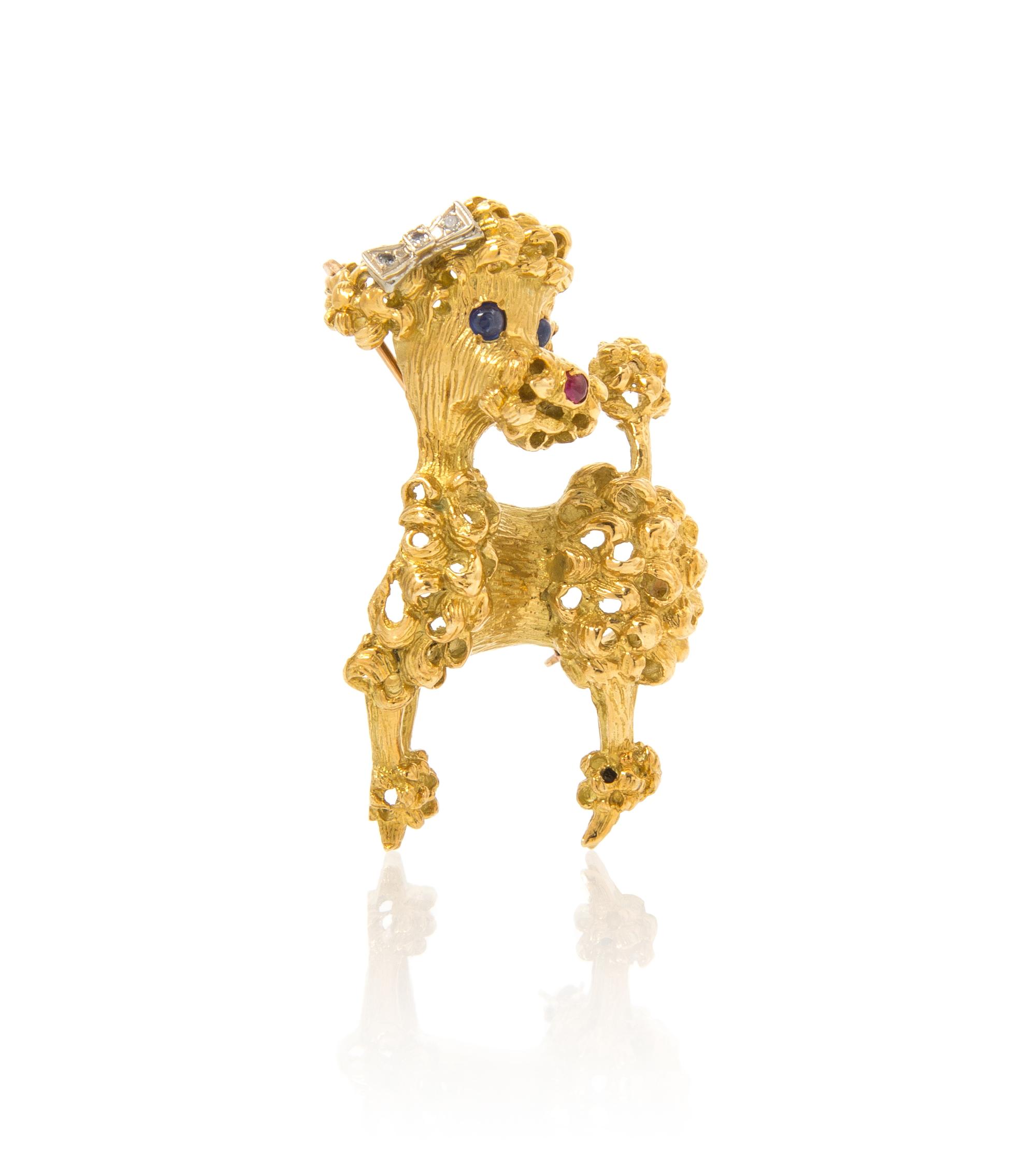 A 14 Karat Gold, Sapphire, Ruby and Diamond Poodle Brooch, 13.20 dwts.