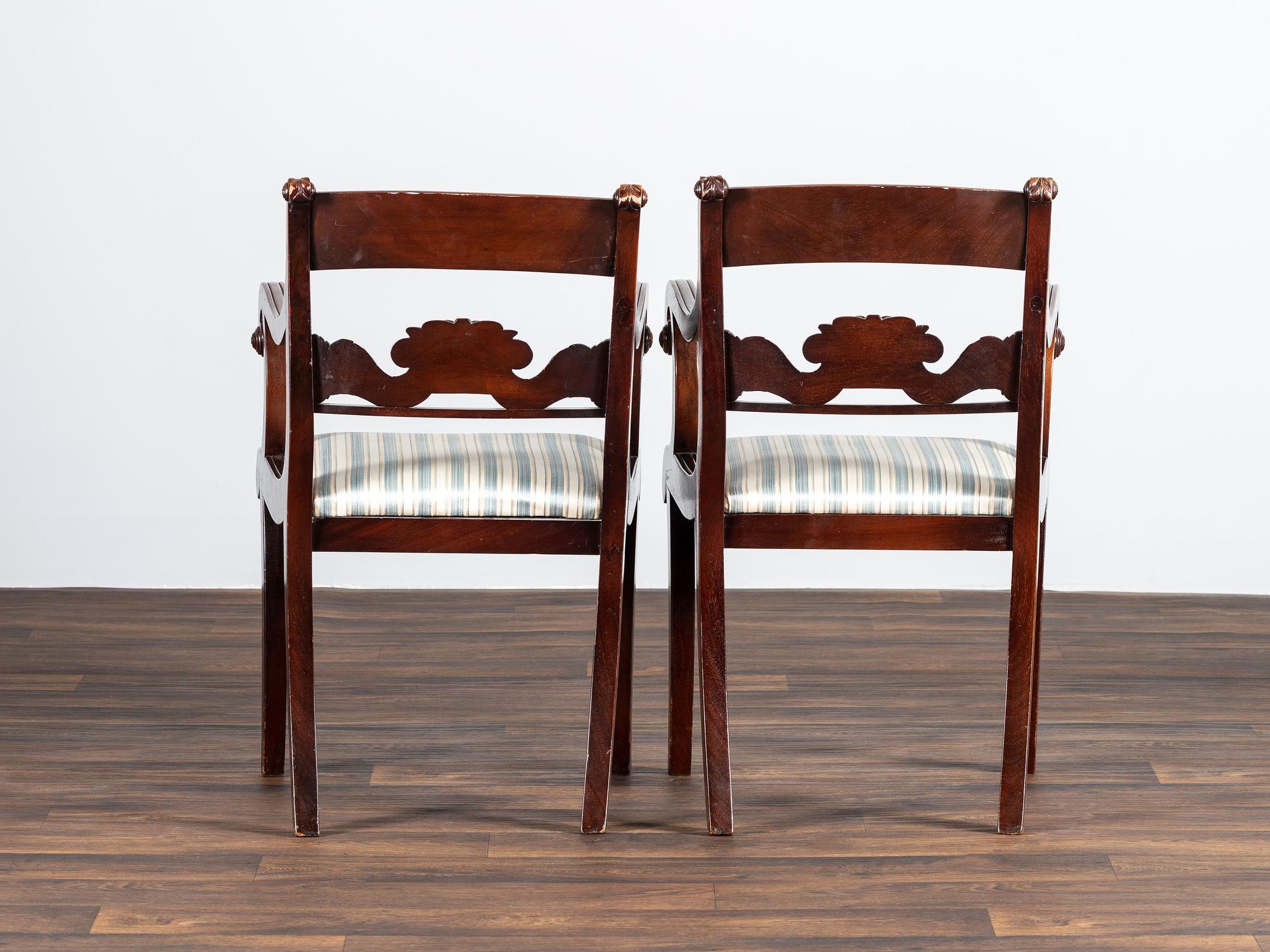 A Pair of Classical Cornucopia Carved Mahogany Armchairs