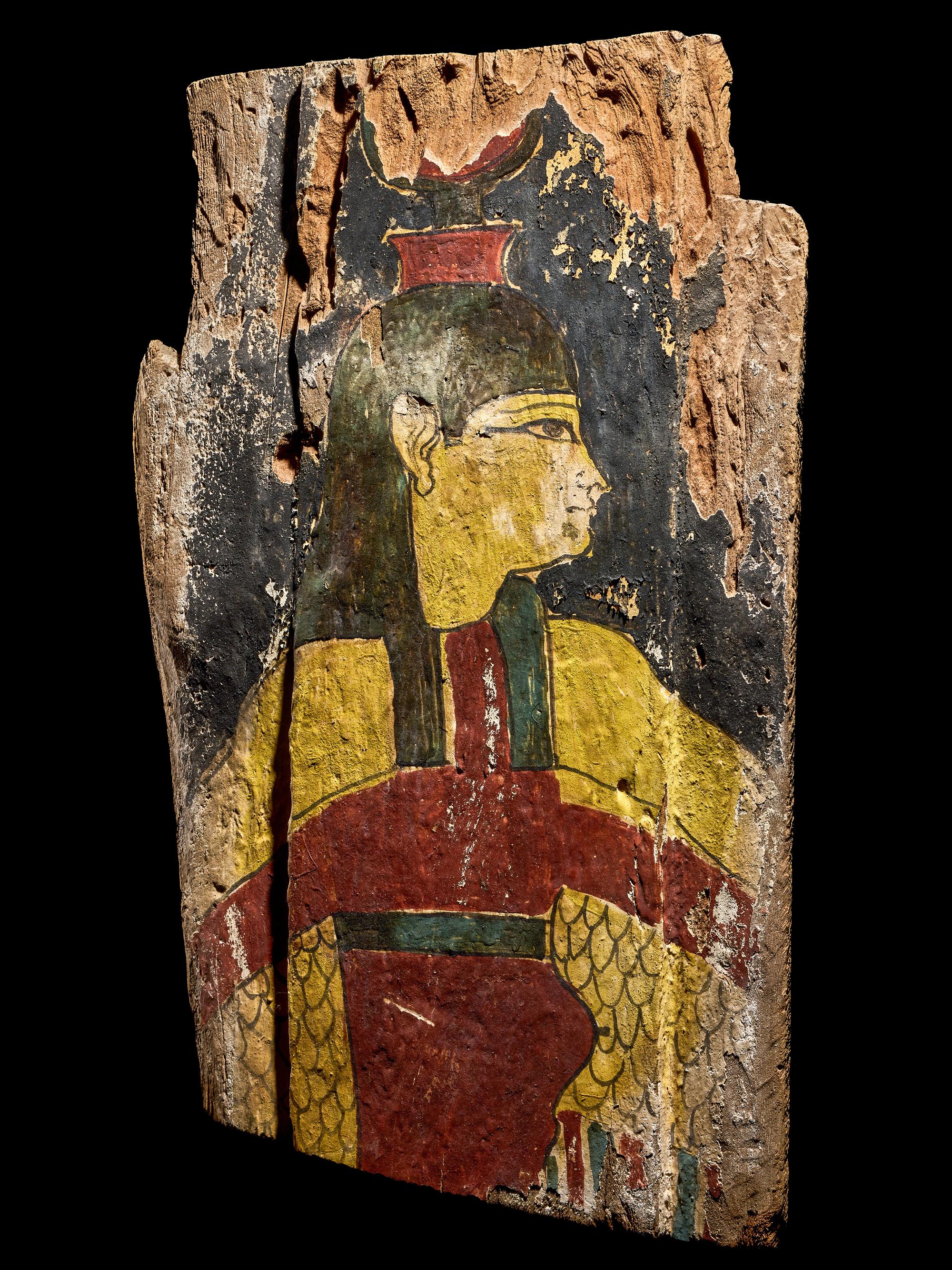 An Egyptian Painted Wood Sarcophagus Fragment with Isis