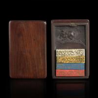 A Chinese carved "Duan" ink stone, colored ink sticks, and hardwood case 浮雕砚台墨条及硬木盒子 The stone Qing dynasty ?????