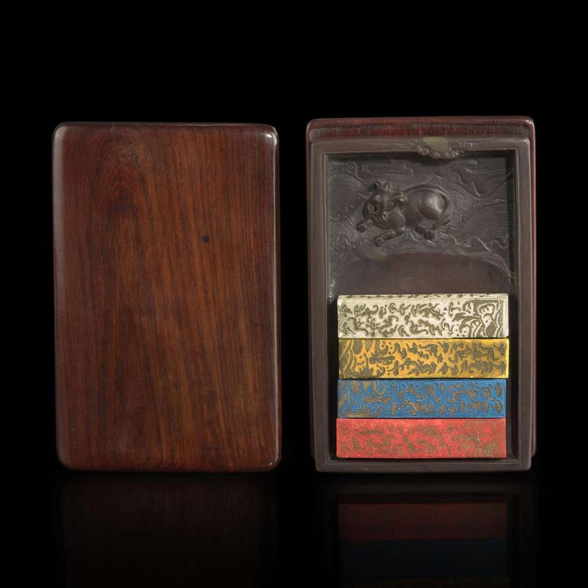 A Chinese carved "Duan" ink stone, colored ink sticks, and hardwood case 浮雕砚台墨条及硬木盒子 The stone Qing dynasty ?????