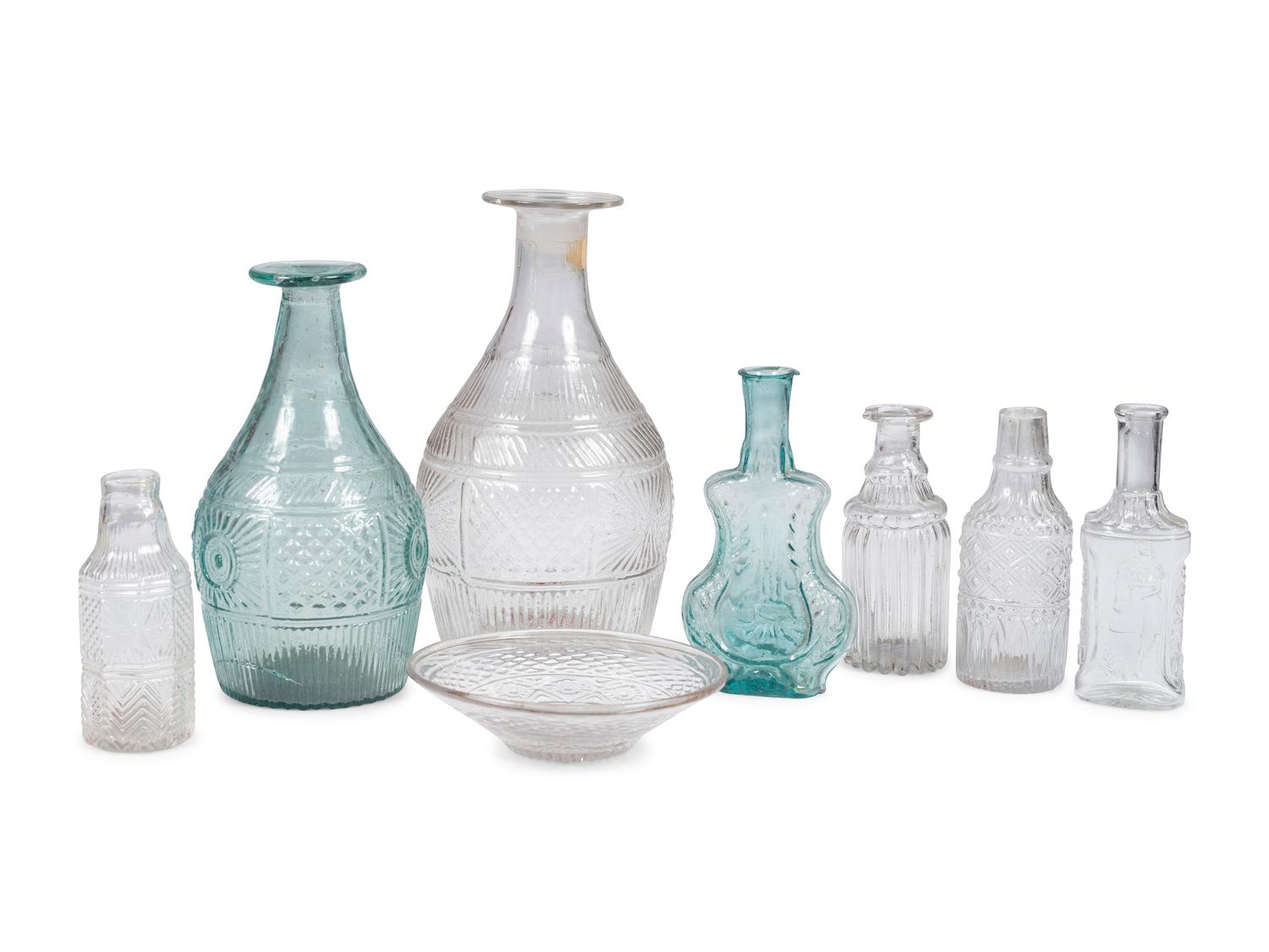 Eight Early American Pattern Molded Glass Bottles and Flasks