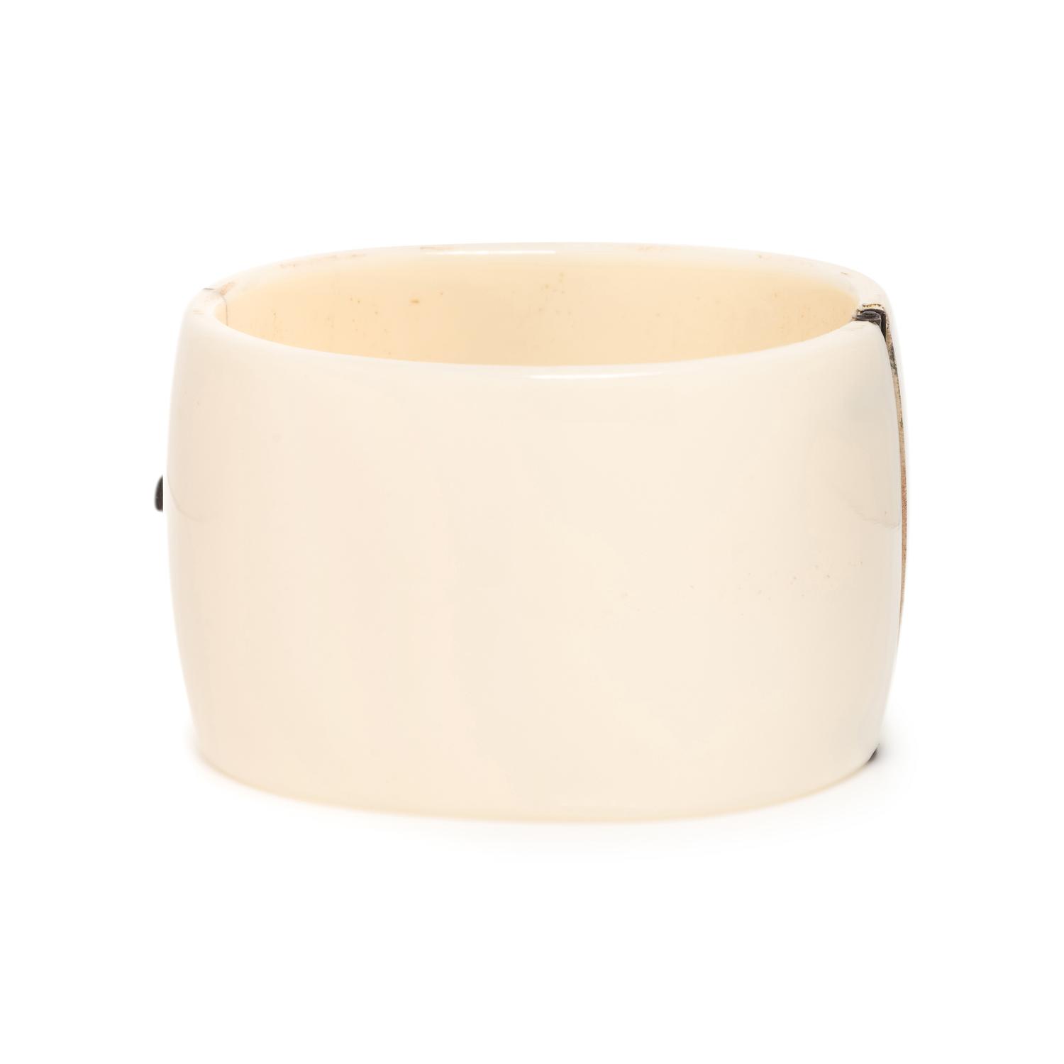 EMERALD, DIAMOND AND PLASTIC BANGLE BRACELET