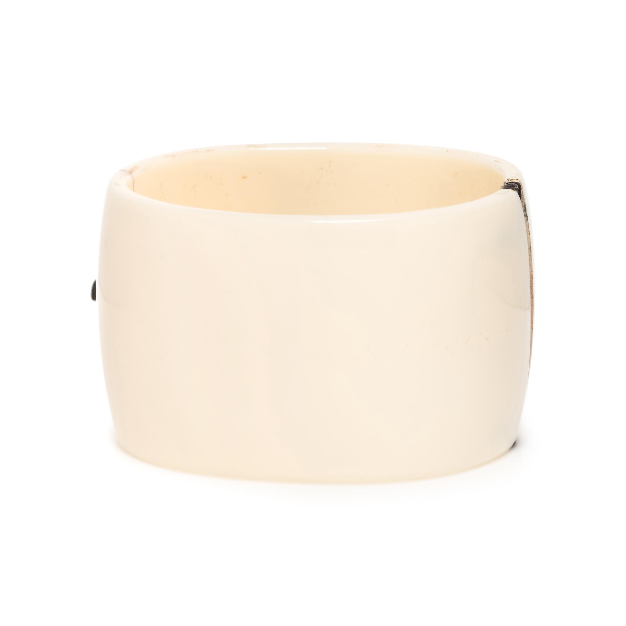 EMERALD, DIAMOND AND PLASTIC BANGLE BRACELET
