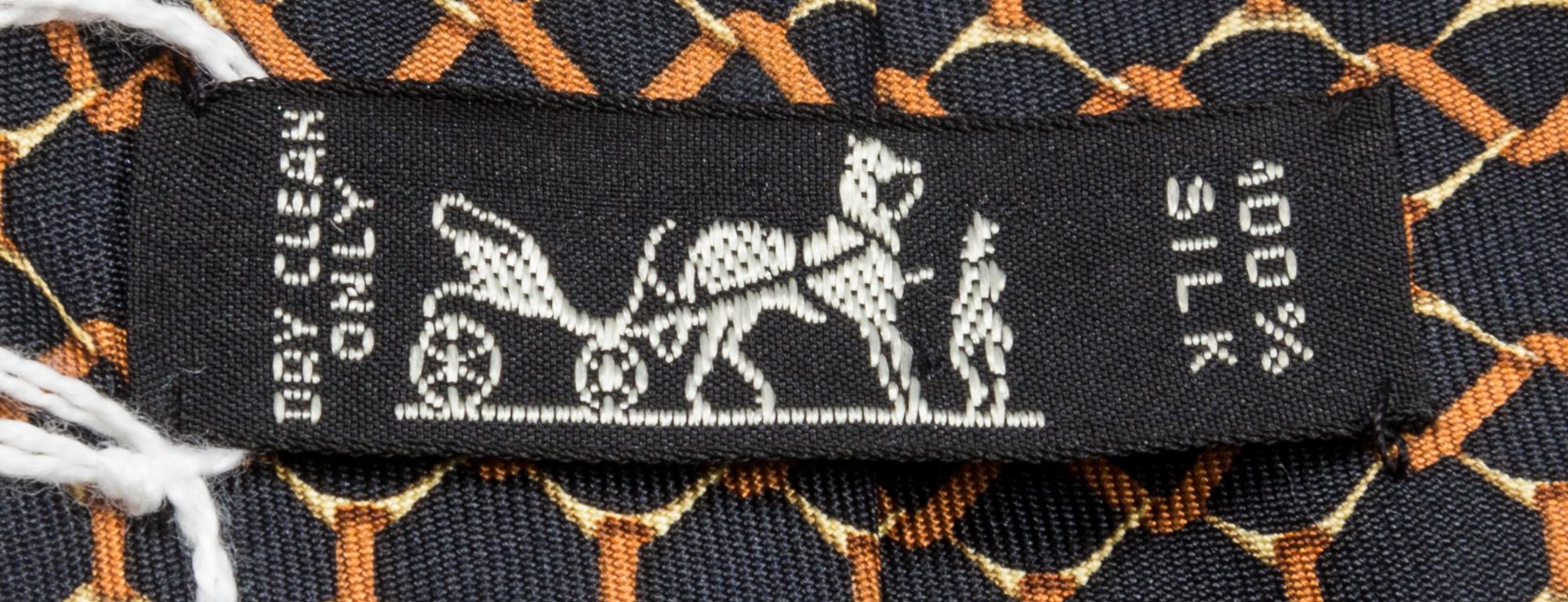 A Group of Three Hermes Silk Ties, 3.15" wide.