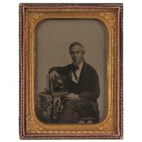 Occupational Half Plate Ambrotype of Photographer Posed with his Daguerreotype Camera