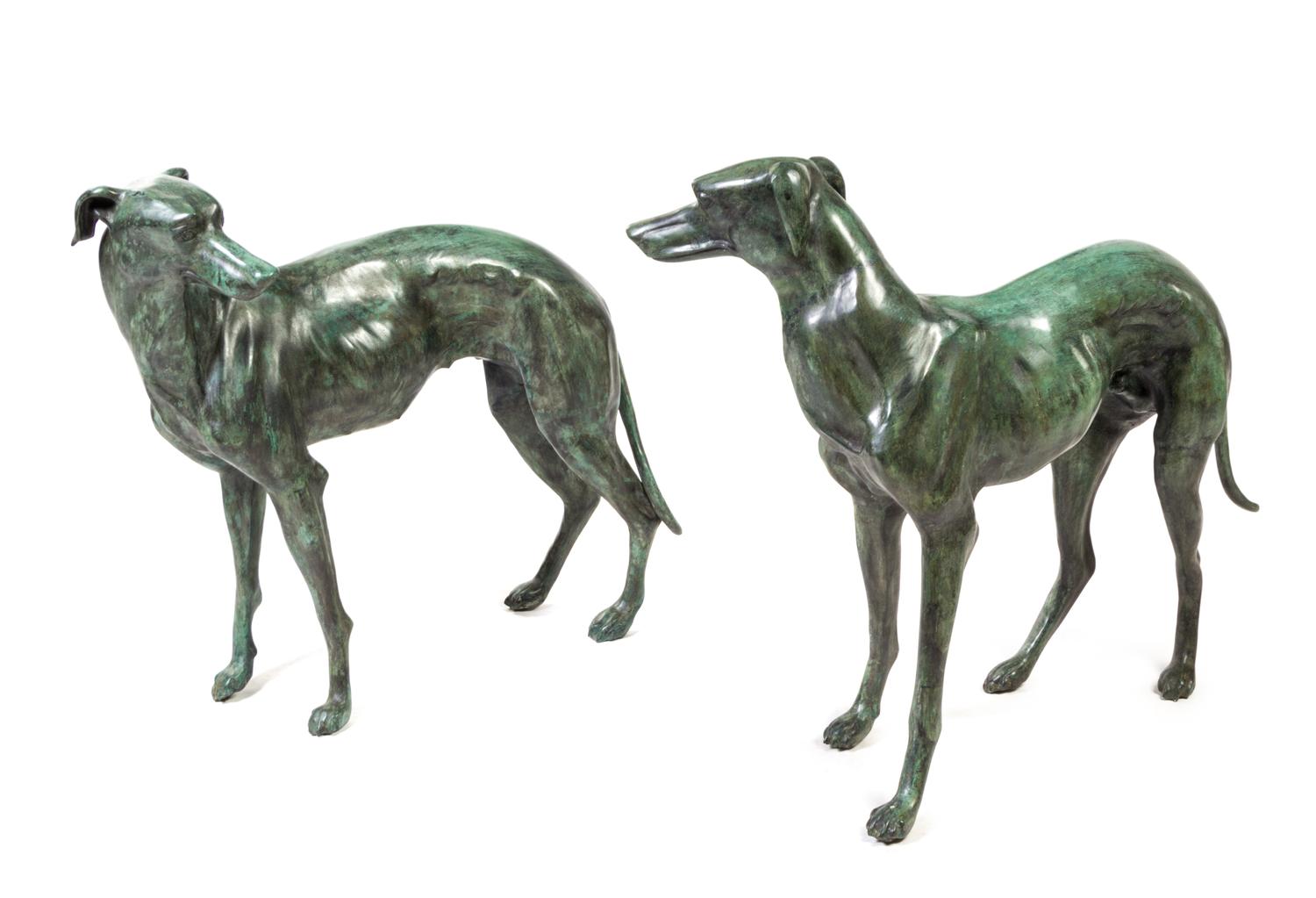 A Pair of Patinated Cast Metal Whippets Height 31 1/2 inches.