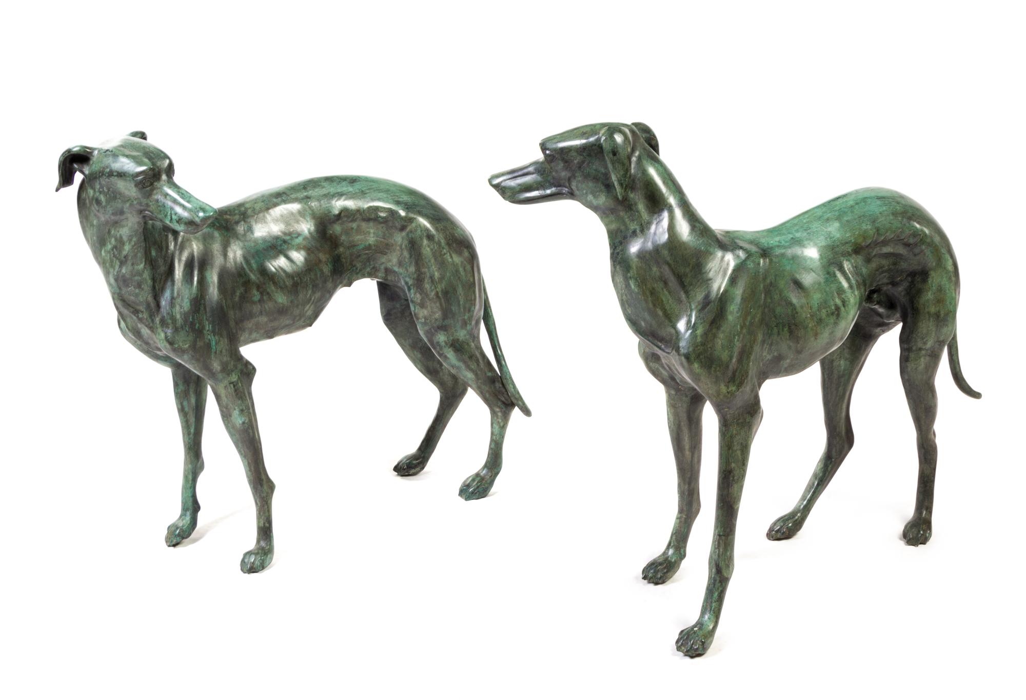 A Pair of Patinated Cast Metal Whippets Height 31 1/2 inches.