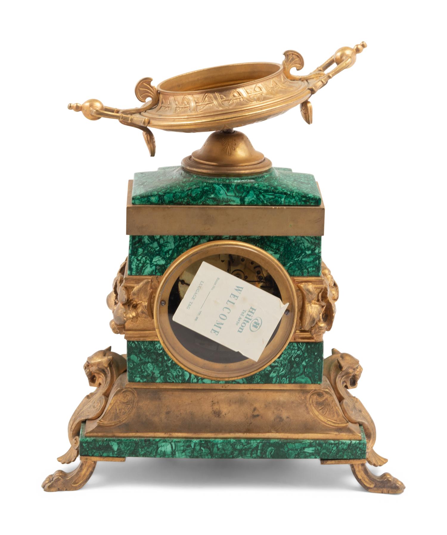 An Empire Style Gilt Bronze and Malachite Veneered Mantel Clock