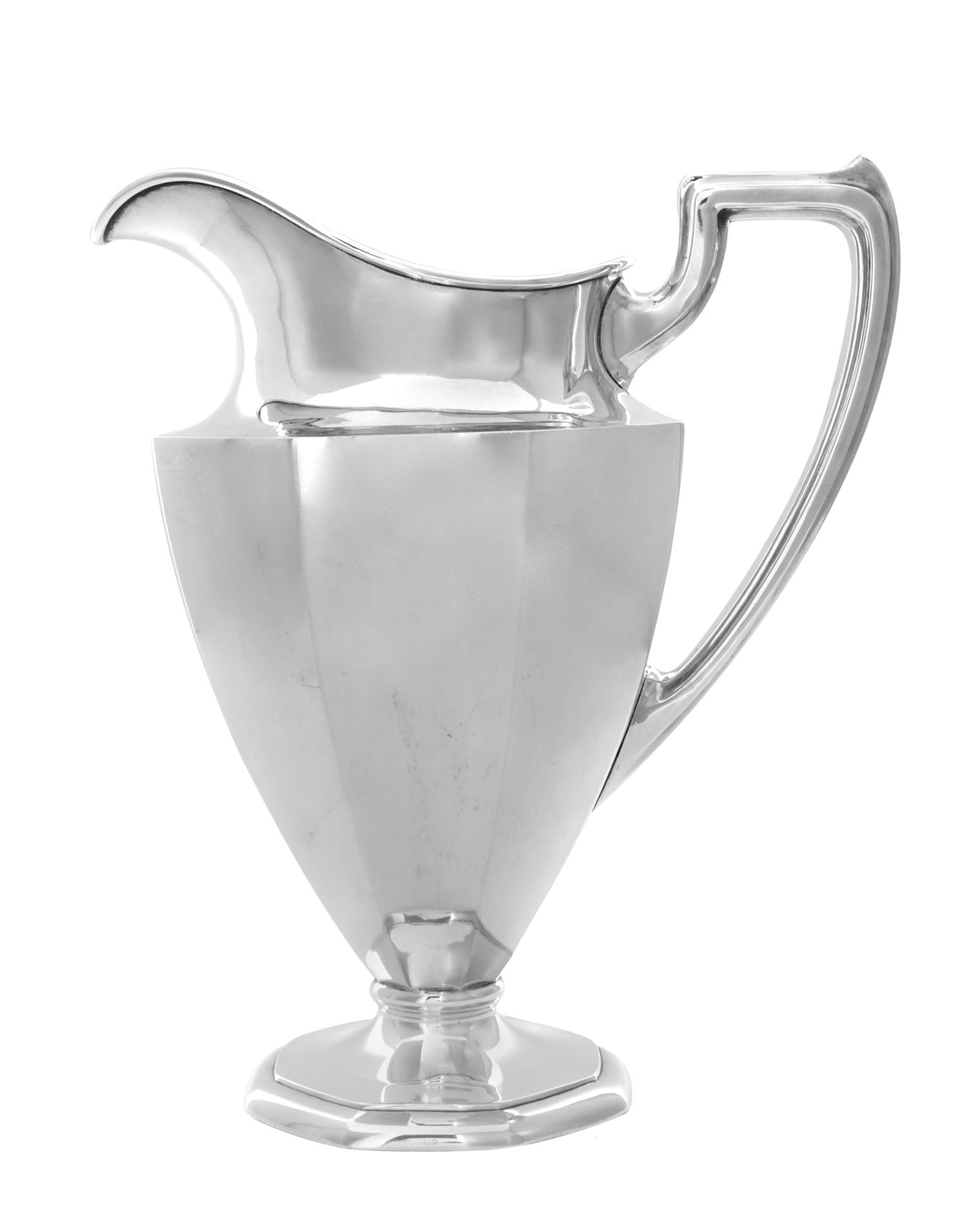 An American Silver Water Pitcher, International Silver Co., Meriden, CT, the paneled tapering body raised on an octagonal foot.