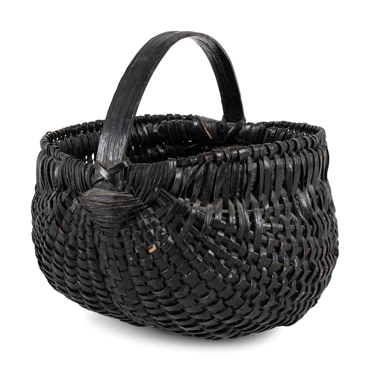 A Woven Buttocks Basket in Black Paint