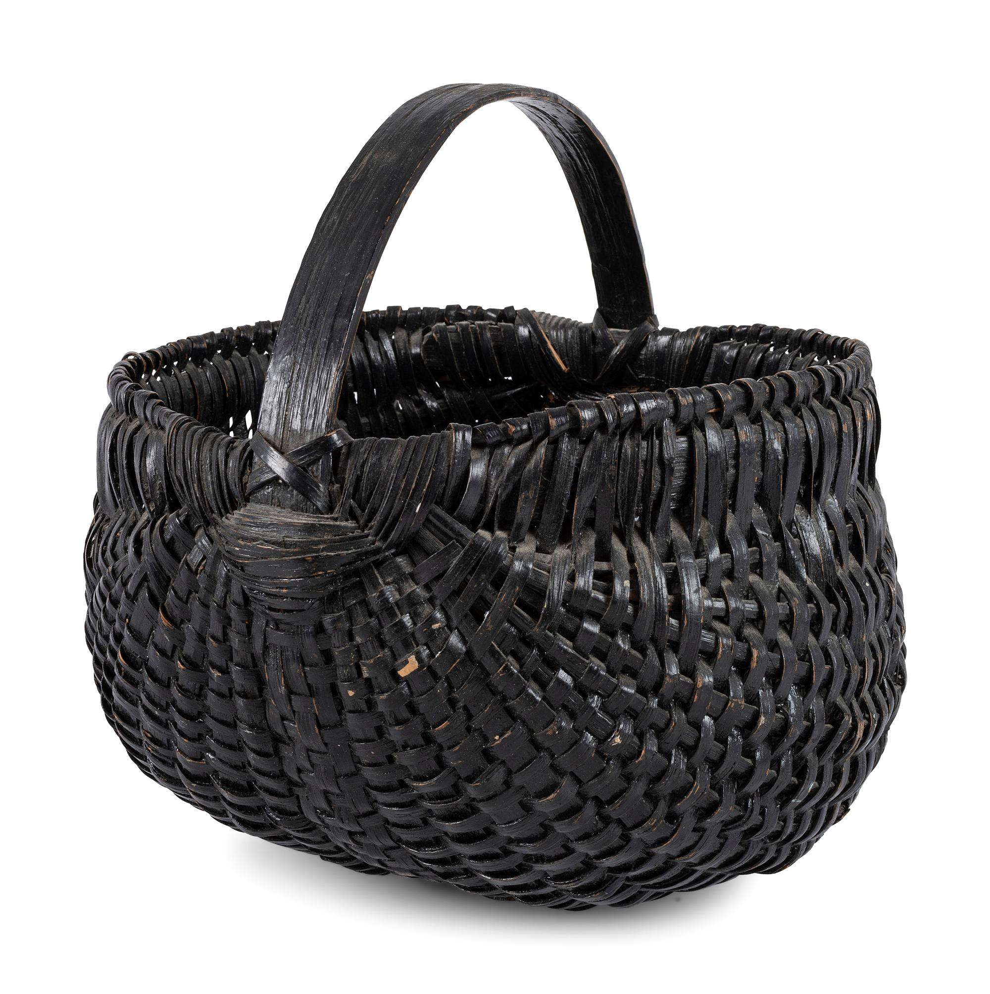 A Woven Buttocks Basket in Black Paint