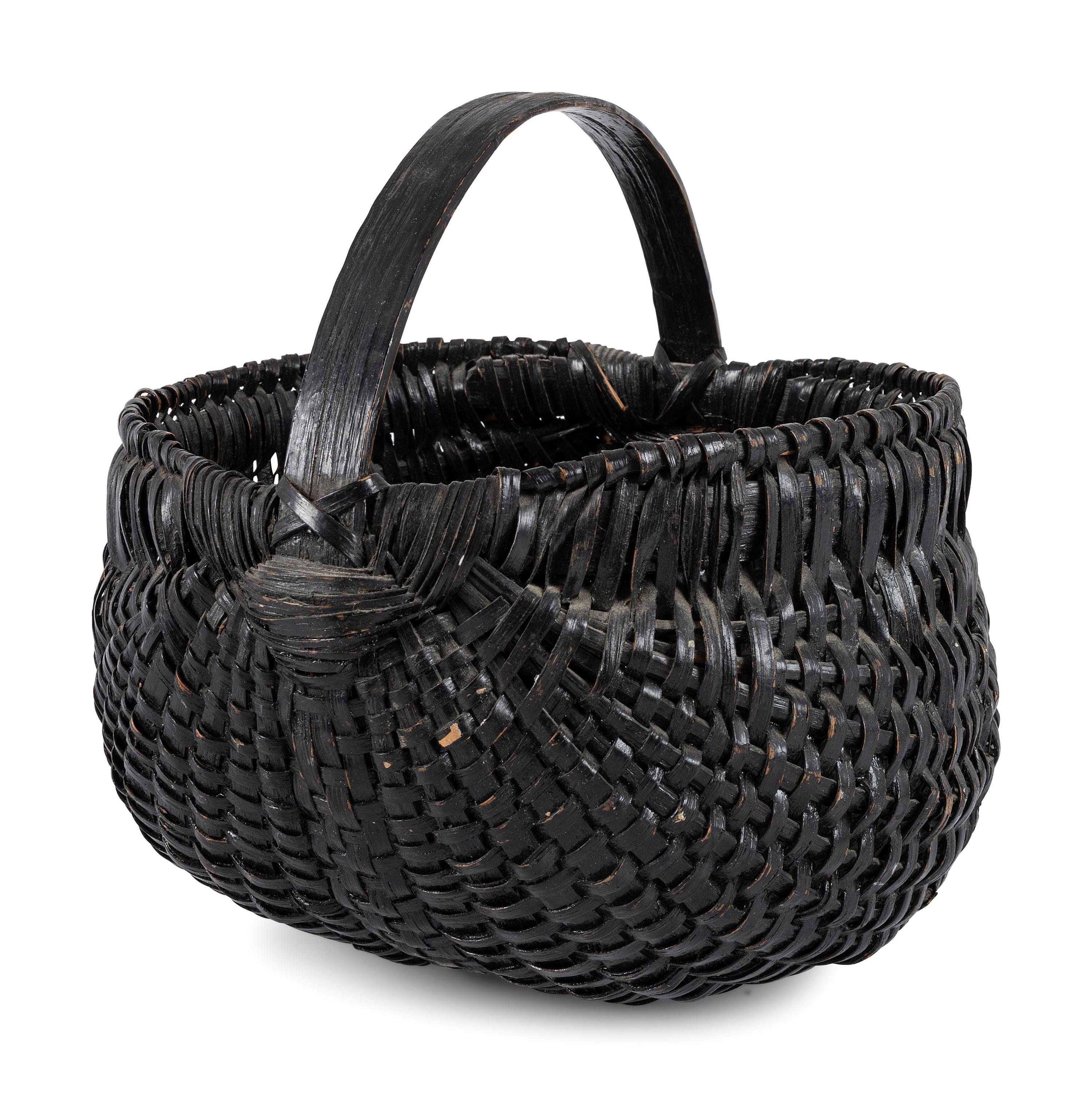 A Woven Buttocks Basket in Black Paint