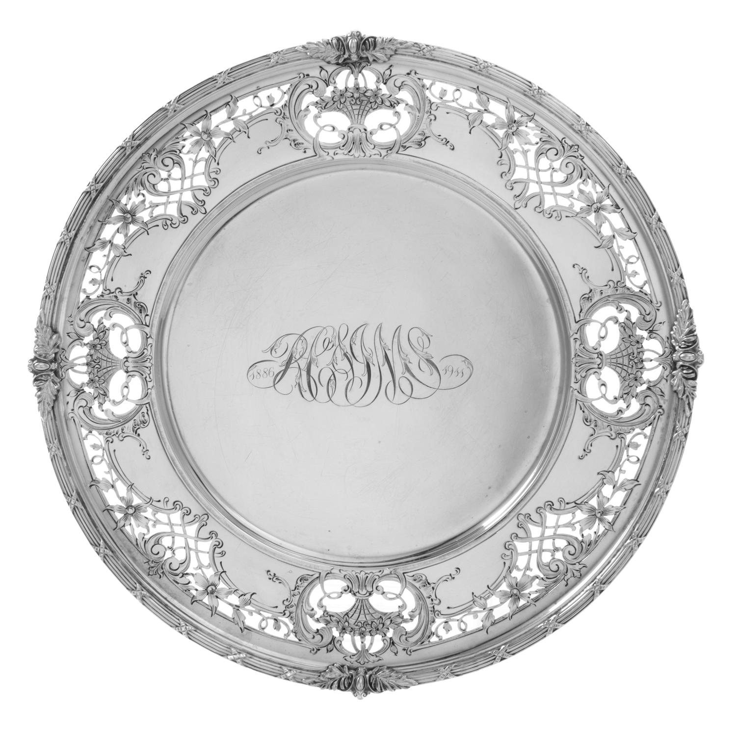 An American Silver Commemorative Charger, Redlich & Company, New York, NY, having a bundled reed and foliate decorated rim surrounding