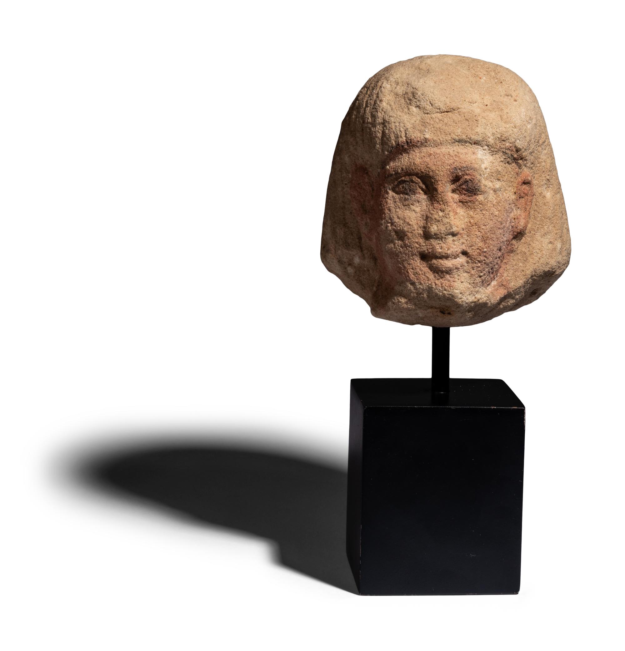 An Egyptian Painted Limestone Portrait Head of an Official