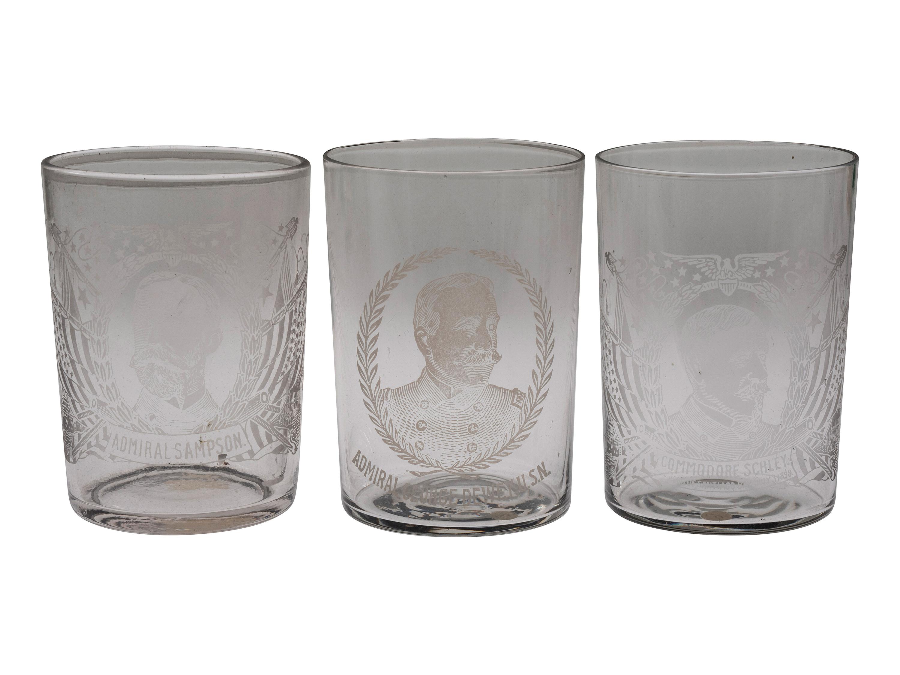 [SPANISH-AMERICAN WAR]. A group of milk glass, paperweights, glasses, and other souvenirs including items commemorating the Maine and Admiral Dewey, including: