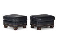 A Pair of Hancock and Moore Brass-Tacked Leather Chairs
