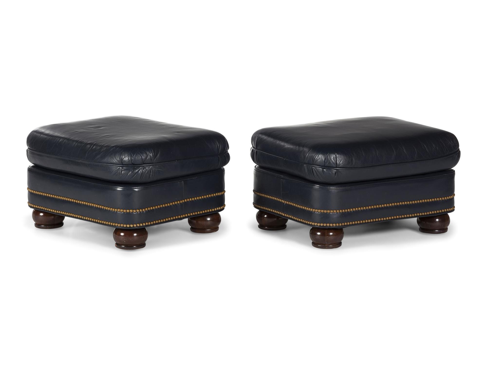A Pair of Hancock and Moore Brass-Tacked Leather Chairs
