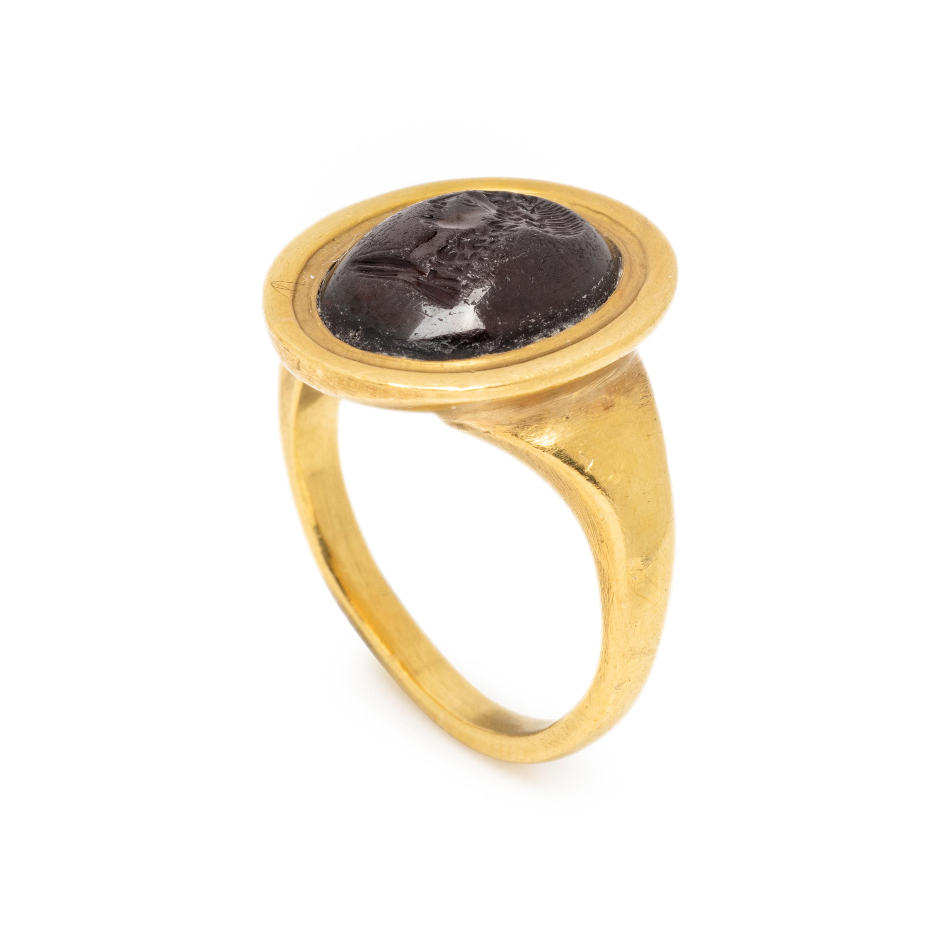 ATTILIO CODOGNATO, YELLOW GOLD AND GARNET INTAGLIO RING