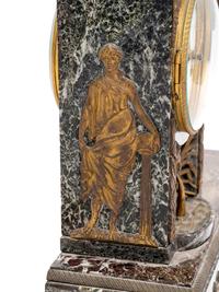 An Empire Style Gilt Metal and Marble Figural Mantel Clock