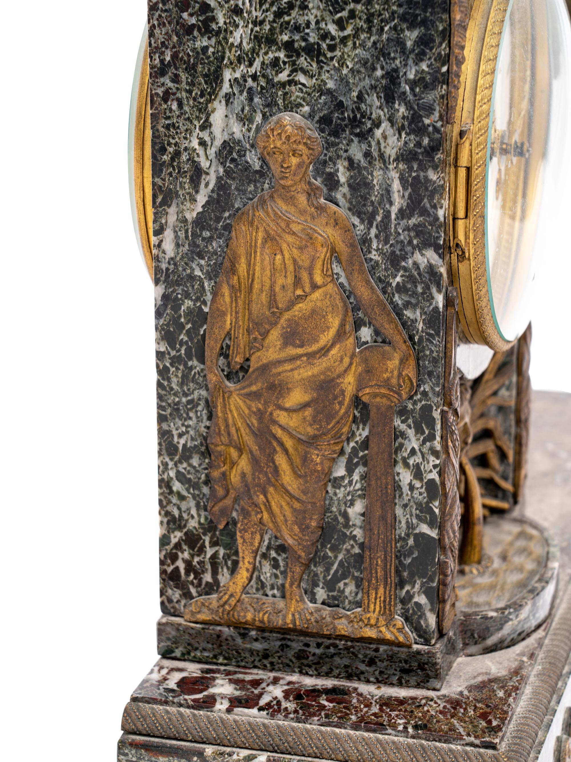 An Empire Style Gilt Metal and Marble Figural Mantel Clock