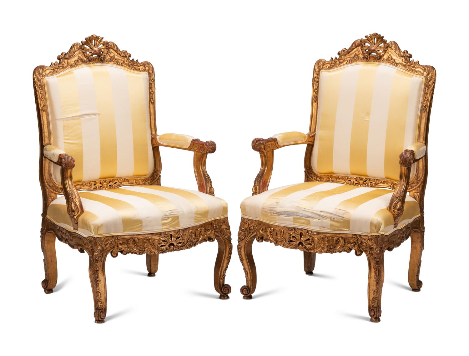 A Pair of Régence Style Giltwood Fauteuils