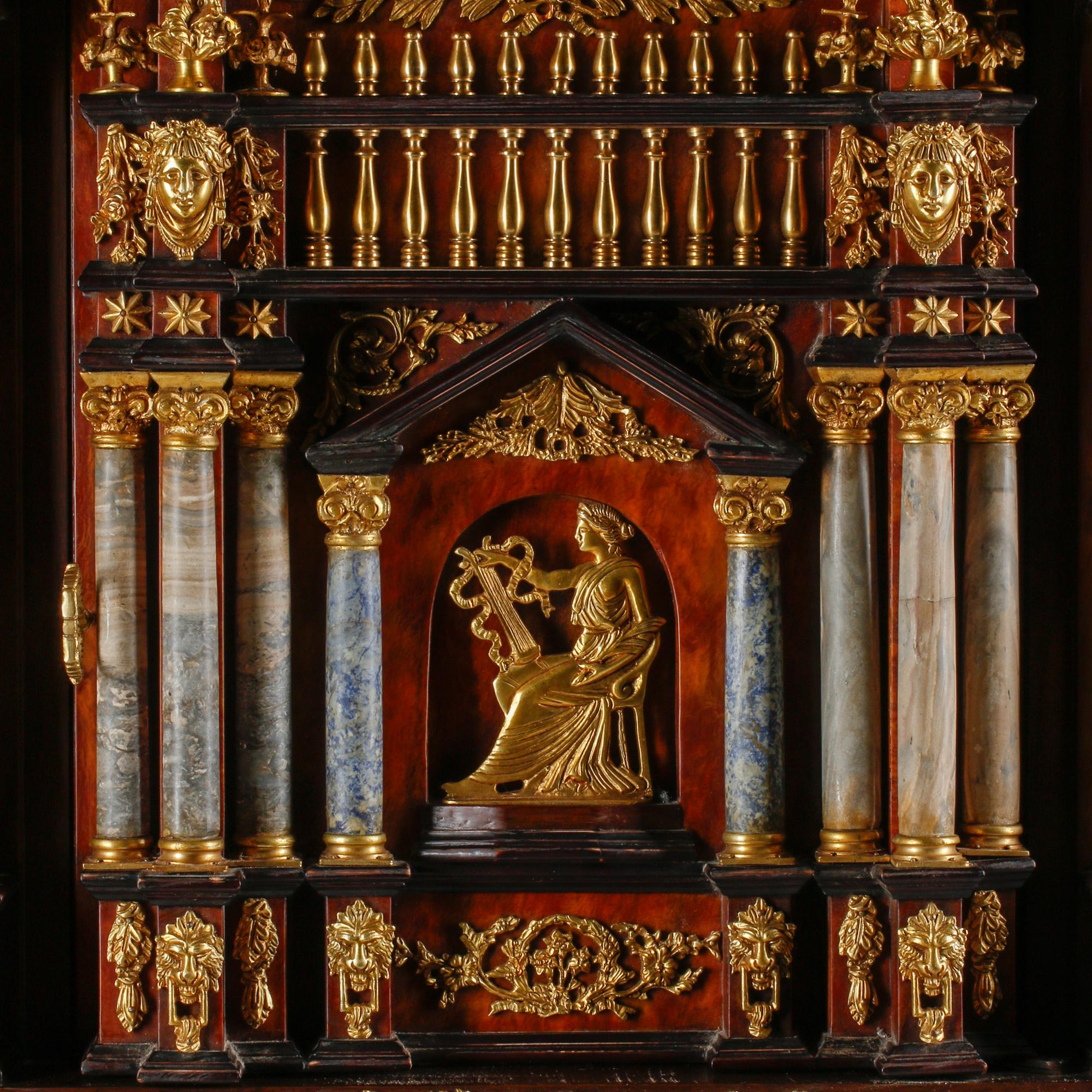 An Italian Baroque Style Gilt Bronze Mounted Pietra Dura, Lapis Lazuli and Giltwood Cabinet on Stand