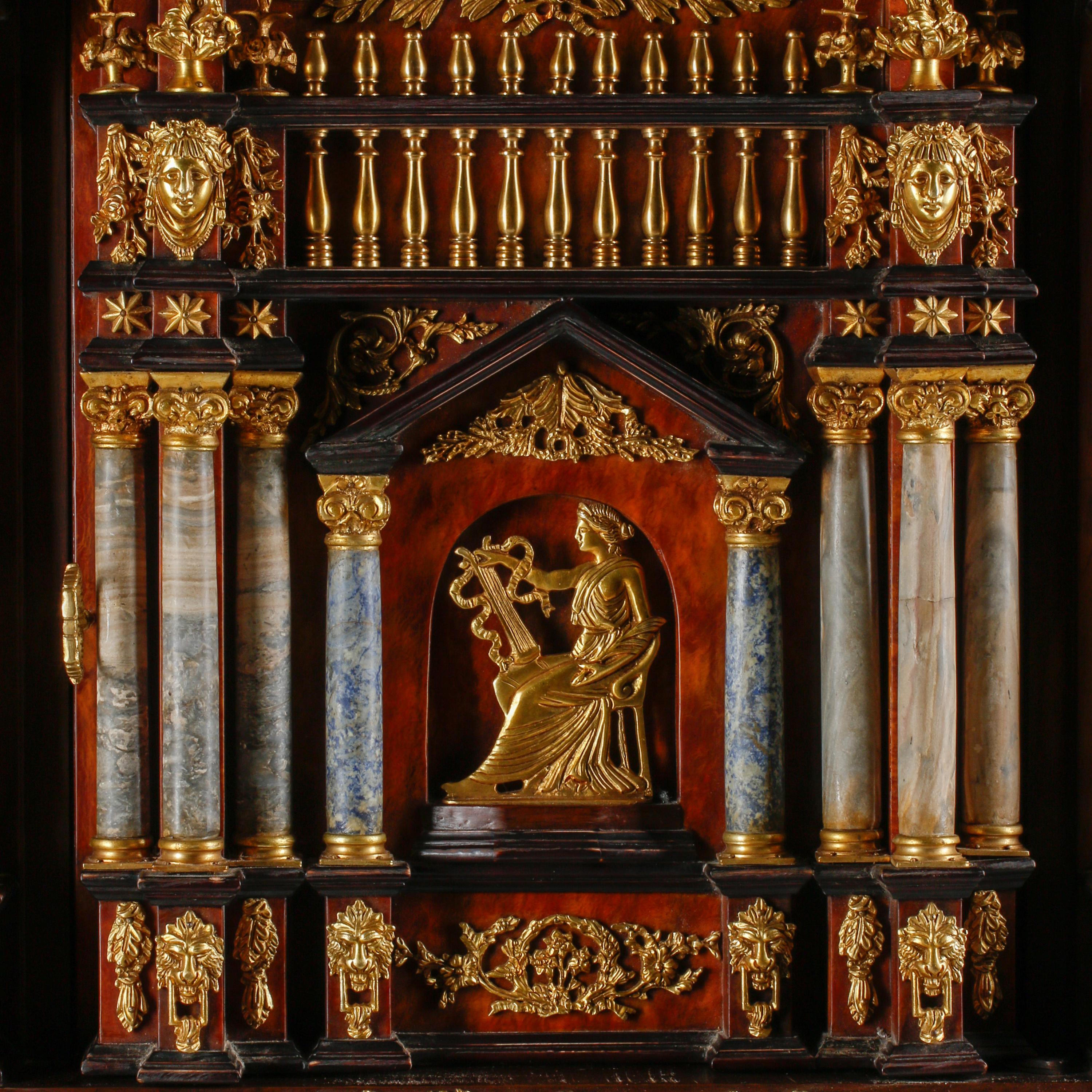 An Italian Baroque Style Gilt Bronze Mounted Pietra Dura, Lapis Lazuli and Giltwood Cabinet on Stand