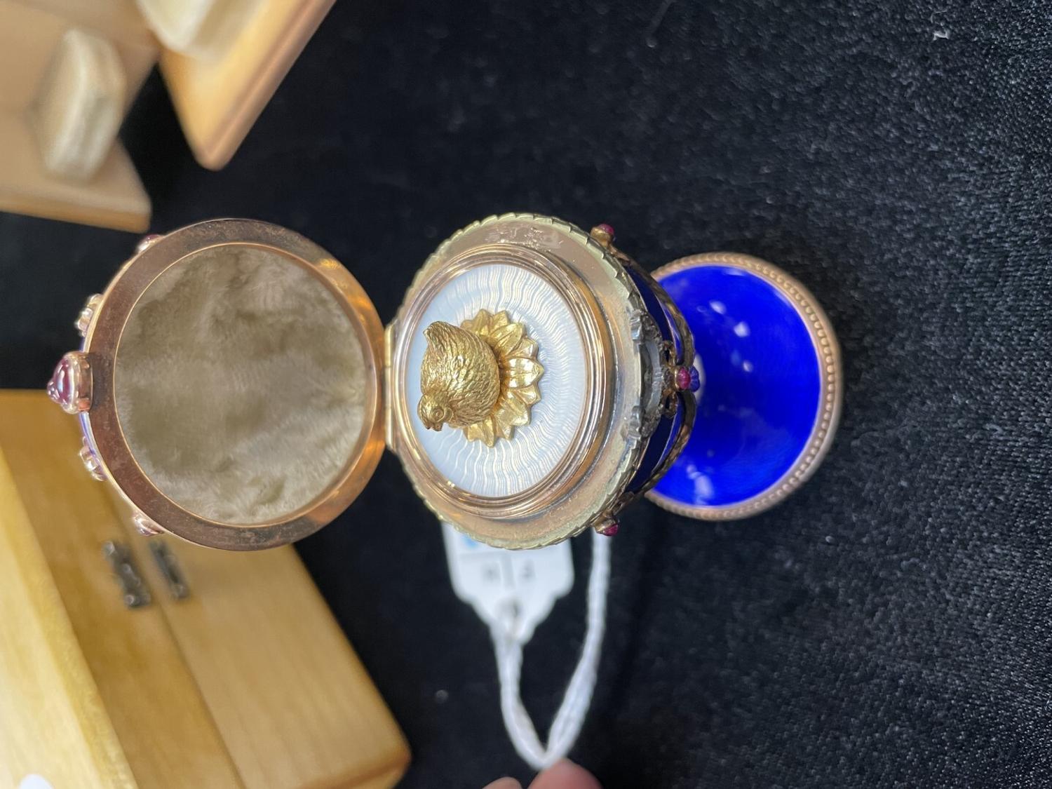 A 14 Karat Vari-Color Gold, Guilloché Enamel, Diamond, and Cabochon Jewel-Mounted Egg-Form Perfume and a Related Guilloché Enamel, 14 Karat Vari-Color Gold, Diamond, and Cabochon-Mounted Surprise Egg