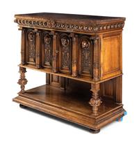 A Renaissance Revival Carved Walnut Marble-Top Cabinet